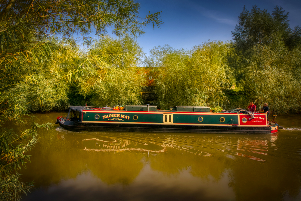 Narrowboat passing the culverted drainage channel, all that remains of the great river channel that flowed in the Roman period